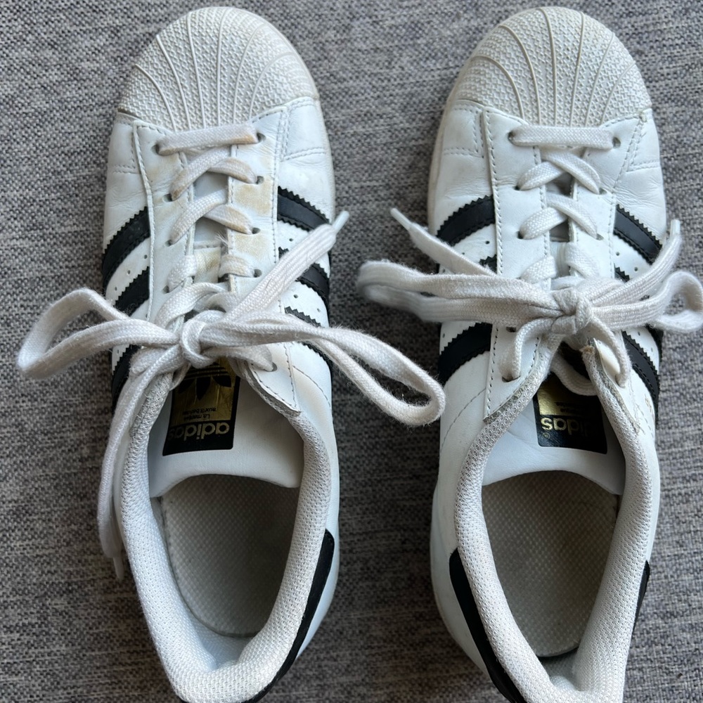 Adidas black and white Superstar sneakers